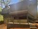 Multi-level wooden deck with a screened porch offers a private outdoor space at 2864 Sudbury Ct, Marietta, GA 30062