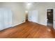 Bright bedroom with wood floors, neutral walls, ceiling fan, dual closets and an open doorway to a tiled bathroom at 2864 Sudbury Ct, Marietta, GA 30062