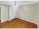 Clean bedroom features hardwood floors, white trim and a closet with bifold doors at 2864 Sudbury Ct, Marietta, GA 30062