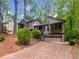 Charming two-story home with mature trees, and a two-car garage in a wooded area at 2864 Sudbury Ct, Marietta, GA 30062