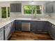 Modern kitchen featuring sleek countertops, stainless steel appliances, and ample cabinet space with a window view at 2864 Sudbury Ct, Marietta, GA 30062