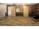 Living room showcases wood paneled walls, wood-look floors, and barn doors at 2864 Sudbury Ct, Marietta, GA 30062