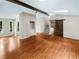 Sun-filled living room features hardwood floors, dark wood beams, and easy access to other rooms at 2864 Sudbury Ct, Marietta, GA 30062