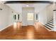 Open-concept living room with hardwood floors and large windows that let in natural light and views of the outdoors at 2864 Sudbury Ct, Marietta, GA 30062