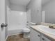 Clean bathroom featuring tile flooring, a shower-tub combo, and white vanity at 3542 Broad Oak Ct, Decatur, GA 30034