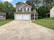 Charming two-story home with a two-car garage and a well-maintained front yard at 3542 Broad Oak Ct, Decatur, GA 30034
