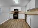 Modern kitchen features white cabinets, granite countertops, and stainless steel appliances at 3542 Broad Oak Ct, Decatur, GA 30034