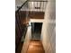 Stairway leading to the basement with wood stairs and railing at 1433 Woodland Sw Ter, Atlanta, GA 30311