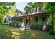 Charming home with a covered front porch, dormer windows, and manicured landscaping at 465 Se Willowbrook Se Dr, Smyrna, GA 30082