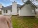 Backyard featuring a concrete patio and ample green space, perfect for outdoor enjoyment at 402 Lafayette St, Dallas, GA 30157