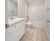 Clean bathroom featuring a tub and shower combination, a single sink vanity, and neutral tile flooring at 402 Lafayette St, Dallas, GA 30157