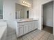 Bright bathroom with a double sink vanity, a large mirror, and ample lighting for a refreshing space at 402 Lafayette St, Dallas, GA 30157
