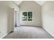 Inviting bedroom with a large window, closet, and neutral carpet at 402 Lafayette St, Dallas, GA 30157