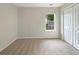 Comfortable bedroom featuring a window, closet space, and neutral-toned walls at 402 Lafayette St, Dallas, GA 30157