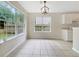 Well-lit dining area boasts large windows and tile flooring, creating an inviting space for meals at 402 Lafayette St, Dallas, GA 30157
