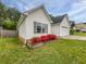 Well-kept home featuring blooming flowers and an attached two-car garage at 402 Lafayette St, Dallas, GA 30157
