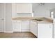 A modern kitchen with white cabinets, sleek countertops, and stainless steel appliances at 402 Lafayette St, Dallas, GA 30157