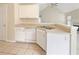 Kitchen featuring white cabinets, tile floors, and stainless steel appliances, offering a practical and clean design at 402 Lafayette St, Dallas, GA 30157