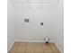 A laundry room featuring tile floors, white walls, and a metal shelf at 402 Lafayette St, Dallas, GA 30157