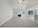 Spacious living room featuring plush carpeting, a fireplace, and lots of natural light at 402 Lafayette St, Dallas, GA 30157