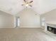 Spacious living room with high ceilings, a ceiling fan, neutral carpet, and fireplace at 402 Lafayette St, Dallas, GA 30157