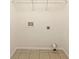 Laundry room with tile floor and wire shelving at 402 Lafayette St, Dallas, GA 30157