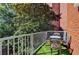 Private balcony with artificial turf and small table and chairs at 385 Ralph Mcgill Ne Blvd # Q, Atlanta, GA 30312