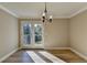 Sunlit dining room with hardwood floors and access to balcony at 385 Ralph Mcgill Ne Blvd # Q, Atlanta, GA 30312