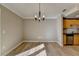 Bright dining room with hardwood floors and modern chandelier at 385 Ralph Mcgill Ne Blvd # Q, Atlanta, GA 30312