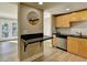 Modern kitchen with light wood cabinets, stainless steel appliances, and a breakfast bar at 385 Ralph Mcgill Ne Blvd # Q, Atlanta, GA 30312