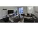 Spacious living room with modern furniture and access to a private balcony at 385 Ralph Mcgill Ne Blvd # Q, Atlanta, GA 30312