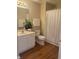 Full bathroom with white cabinets, toilet and tiled floors at 6133 Malloway Ct, Cumming, GA 30041