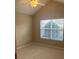 Bedroom with carpet, vaulted ceiling, neutral paint, and bright window at 6133 Malloway Ct, Cumming, GA 30041