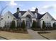 Beautiful clubhouse featuring a grand entrance, manicured landscaping, and a welcoming atmosphere at 6133 Malloway Ct, Cumming, GA 30041