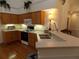 Well-lit kitchen featuring wooden cabinetry, a white countertop, and stainless steel appliances at 6133 Malloway Ct, Cumming, GA 30041