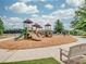 Community playground with multiple slides, climbing structures, and benches for relaxation at 6133 Malloway Ct, Cumming, GA 30041