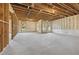 Unfinished basement featuring exposed wood beams and newly installed foam insulation at 64 Dew Lake Ct, Grayson, GA 30017