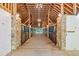 Horse barn featuring stone accents, stall doors, and lighting, adding to the equestrian appeal at 2585 Gelding Ne Ct, Marietta, GA 30062