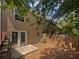 A cozy, private backyard with a wood fence and easy access to the home through elegant glass panelled doors at 806 Brighton Pt, Atlanta, GA 30328