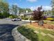 Community clubhouse with parking, landscaping, and well-maintained grounds at 806 Brighton Pt, Atlanta, GA 30328