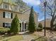 Charming townhouse featuring a well-maintained lawn, mature landscaping, and classic architectural details at 806 Brighton Pt, Atlanta, GA 30328