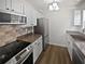 Modern kitchen with stainless steel appliances, sleek countertops, and stylish backsplash at 806 Brighton Pt, Atlanta, GA 30328