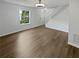 Inviting living room featuring neutral tones, hardwood floors, and a staircase leading to the upper level at 806 Brighton Pt, Atlanta, GA 30328