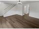 Spacious living area featuring new vinyl wood floors, freshly painted white walls, and a staircase at 806 Brighton Pt, Atlanta, GA 30328