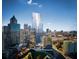 Aerial view of a modern building and cityscape at 45 Ivan Allen Jr Nw Blvd # 2705, Atlanta, GA 30308