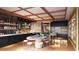 Bright and airy cafe with a large communal table and ample shelving at 45 Ivan Allen Jr Nw Blvd # 2705, Atlanta, GA 30308