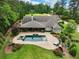 An inviting backyard oasis featuring a large pool and stone patio at 5759 Austin Garner Rd, Sugar Hill, GA 30518