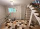 Unfinished basement area with tiled floor and window at 1902 Canterbury St, Decatur, GA 30032