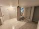 Unfinished basement with tiled floors and stairs at 1902 Canterbury St, Decatur, GA 30032