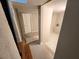 Unfinished basement with tiled floors and a door at 1902 Canterbury St, Decatur, GA 30032